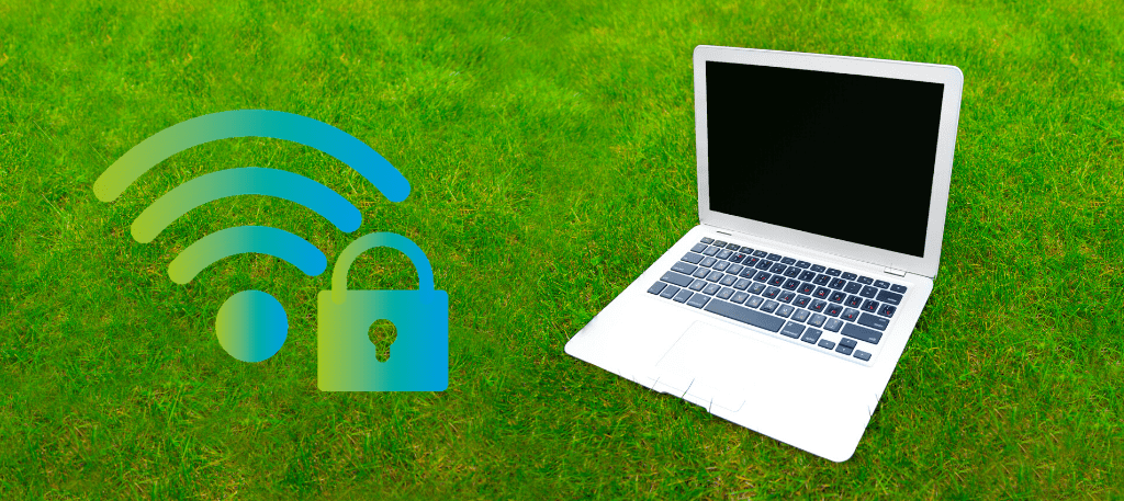Laptop on grass with WiFi icon and padlock to the left of it